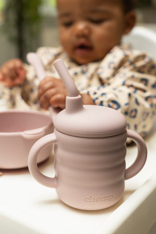 Rose coloured baby sippy cup