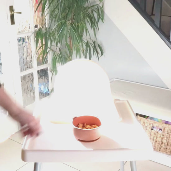 Video shows suction power of the Panda bowl sticking firmly to a highchair with the suction power to lift the highchair off the ground.